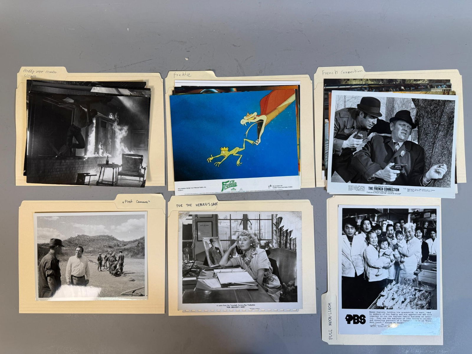 A Collection of Original Film and Television Publicity Stills and Promotional Materials in group of: This lot comprises a group of manila folders containing a diverse assortment of original photographic publicity stills, film stills, and promotional materials. The contents are primarily black and whi