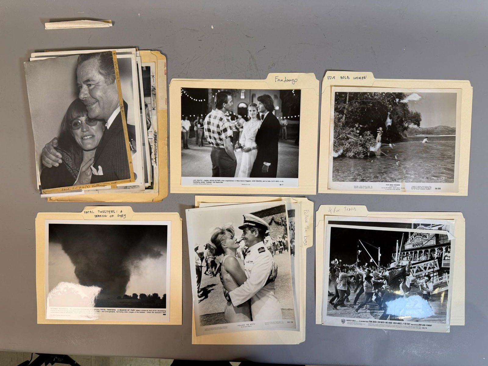 A Collection of Vintage Film and Television Publicity Stills, including 'Fandango,' 'Follow the: A collection of vintage black and white photographic prints, predominantly 8x10 publicity stills and press photos, related to motion pictures and television programming. The collection includes images