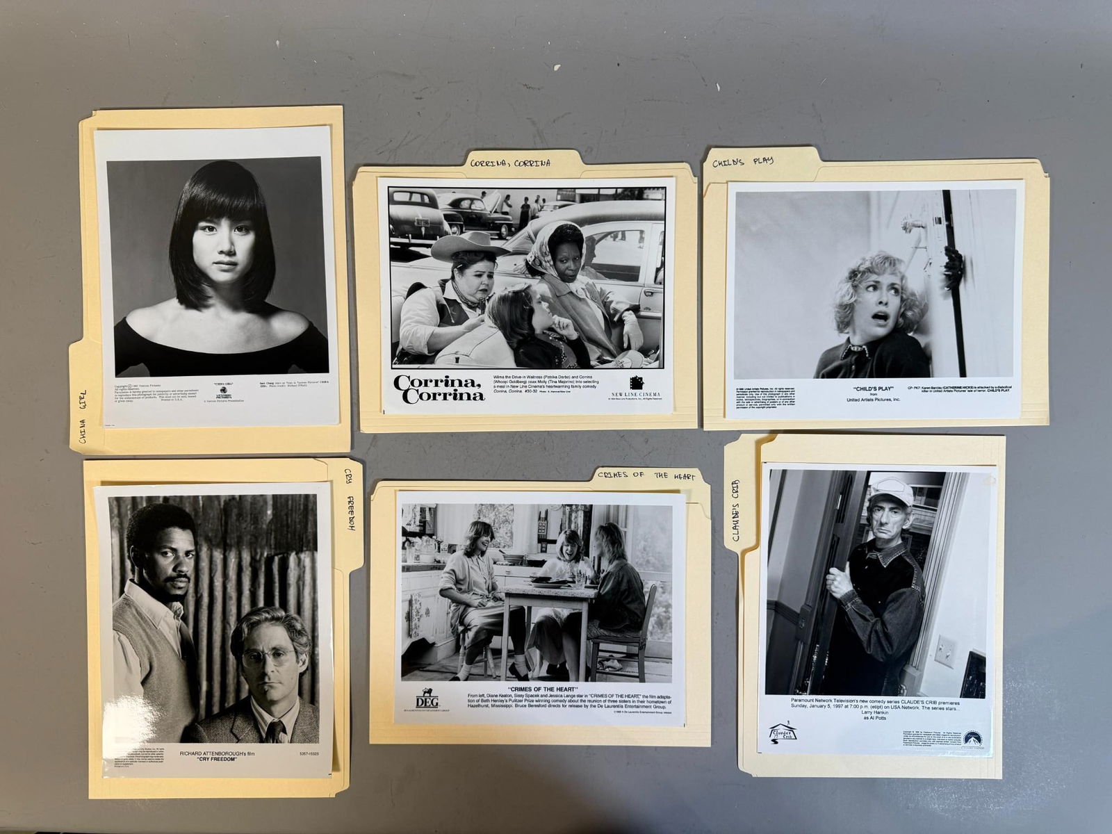 A group of Black and White Promotional Photographs for Films and Television, Late 20th Century: A group of black and white promotional photographic prints, primarily dating from the late 1980s to late 1990s, with visible copyright dates ranging from 1986 to 1997. Each print features imagery from
