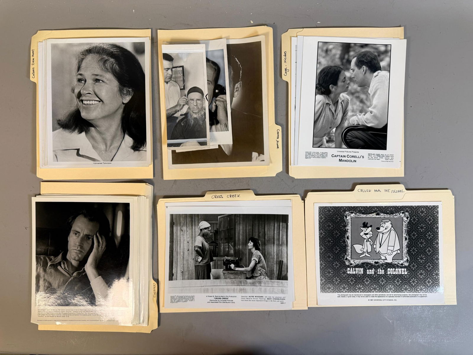 A Collection of Film and Television Press Stills, Mid-20th to Early 21st Century: A collection of black and white photographic prints, primarily consisting of press and promotional stills, housed within labeled manila file folders. The collection spans a period from the mid-20th to