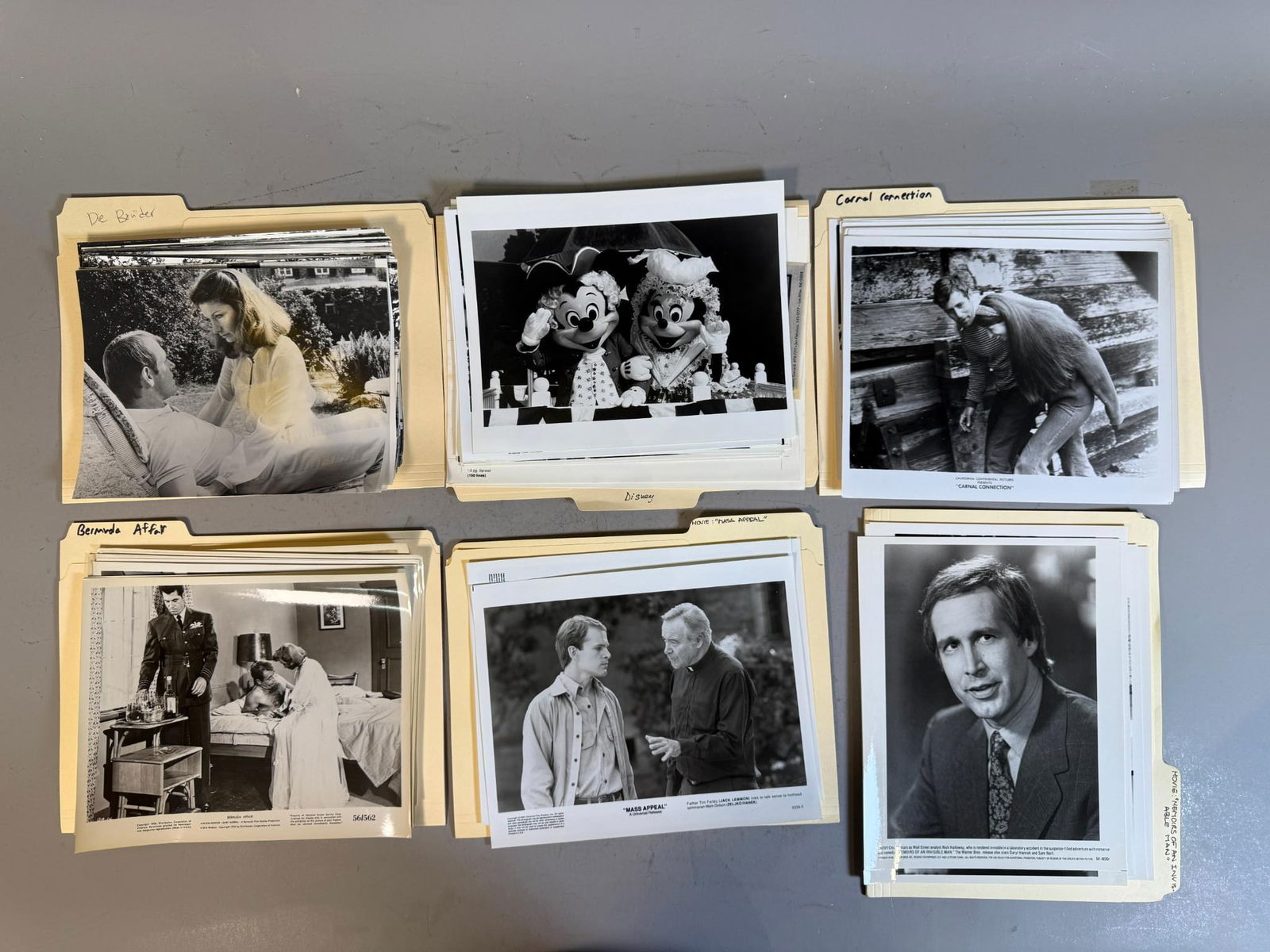 A Collection of Mid to Late 20th Century Film and Television Publicity Stills, Gelatin Silver Prints: A collection of black and white gelatin silver photographic prints on photographic paper, comprising publicity stills and press photos, organized into group of labeled manila folders. The subjects dep
