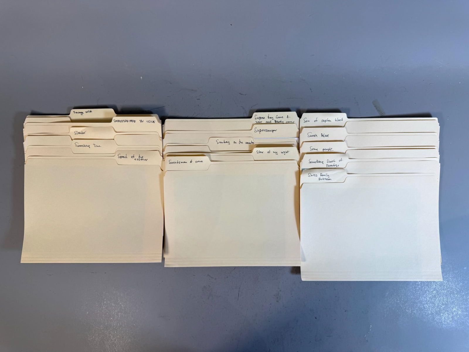 A Collection of Film and Television Promotional Stills in Manila File Folders: This lot comprises a collection of loose photographic prints, housed within group of stacks of standard manila file folders. The collection includes a mix of black and white and color promotional stil