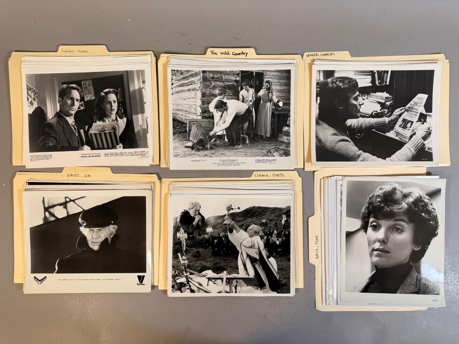 A Collection of Vintage Black and White Press Photos and Film Stills, 1970-1994: A collection of numerous black and white photographic prints, primarily 8x10 inches in size, comprising press photos and film stills from various films and television productions. The prints are organ