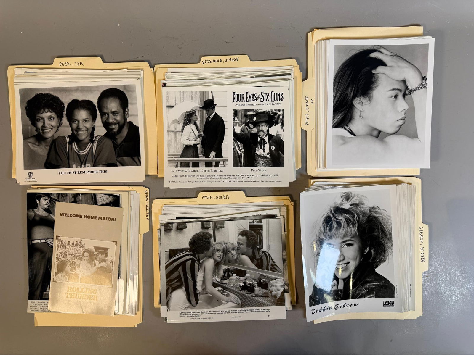 A Collection of Vintage Film, Television, and Music Promotional Press Photographs and Materials,: A group of bundles of vintage black and white promotional photographic prints and associated press materials, dating primarily from the late 1970s through the early 1990s. The prints, typically 8x10 i