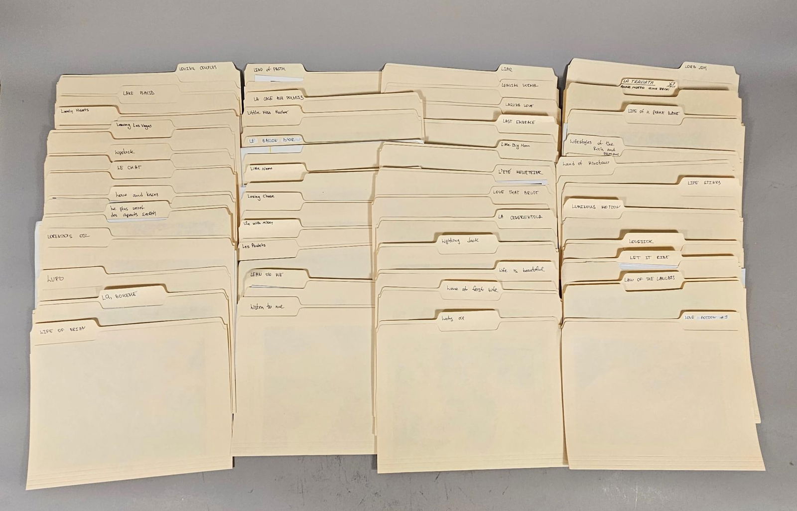 A Collection of Film and Television Production Stills and Promotional Photographs, Late 20th Century: This collection comprises numerous standard manilla file folders, organized alphabetically by handwritten labels on their tabs. The folders contain a variety of predominantly black and white glossy ph