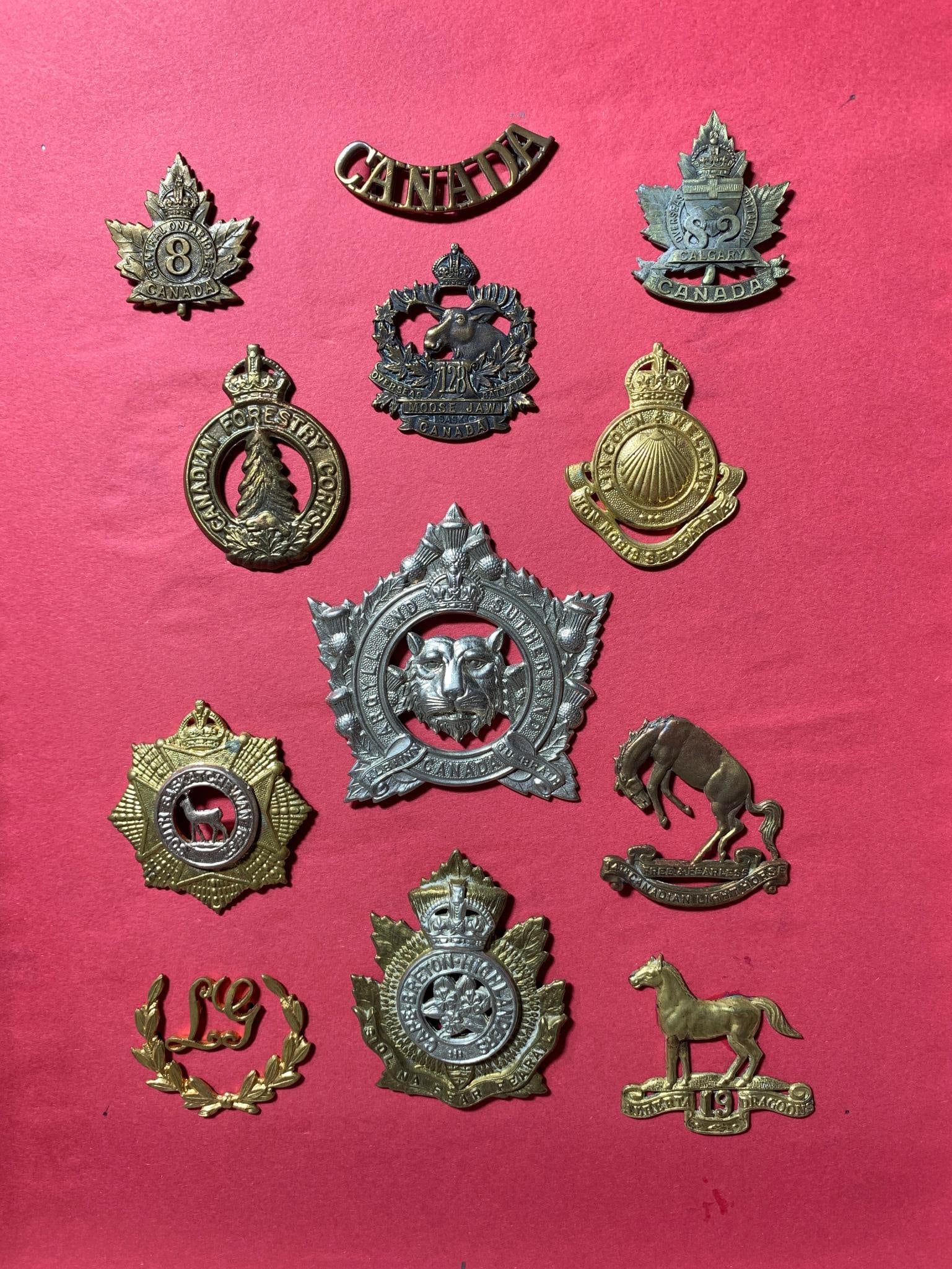 Eleven Canadian Military Cap Badges and One 'CANADA' Title Bar, Early to Mid-20th Century (1 of 20)