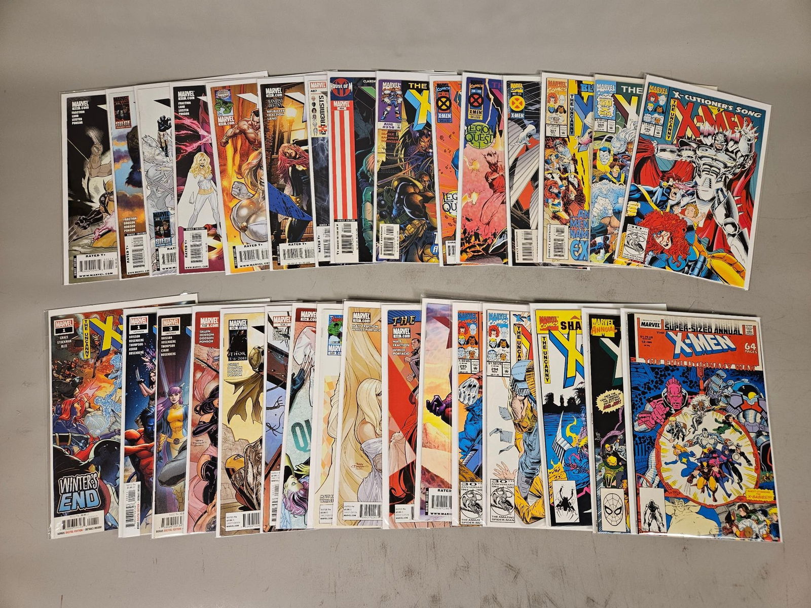 A Collection of 31 Marvel Comics X-Men and Uncanny X-Men Comic Books, Early 1990s-2010s: A collection of 31 Marvel Comics X-Men and Uncanny X-Men comic books. Each issue is protected within a clear plastic sleeve. The issues span various story arcs including "Nation X," "Fatal Attractions