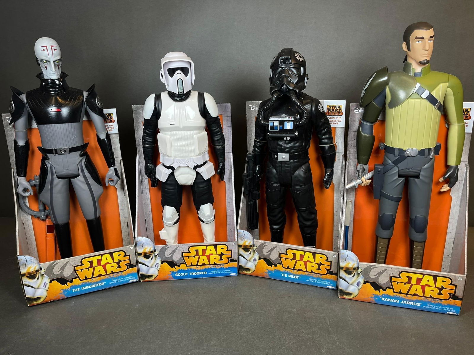 A Group of Four Star Wars Jakks Pacific 18-Inch Action Figures, including The Inquisitor, Scout: A group of four Star Wars Jakks Pacific large-scale action figures, depicting The Inquisitor, Scout Trooper, TIE Pilot, and Kanan Jarrus. Each figure is constructed primarily from molded plastic and a