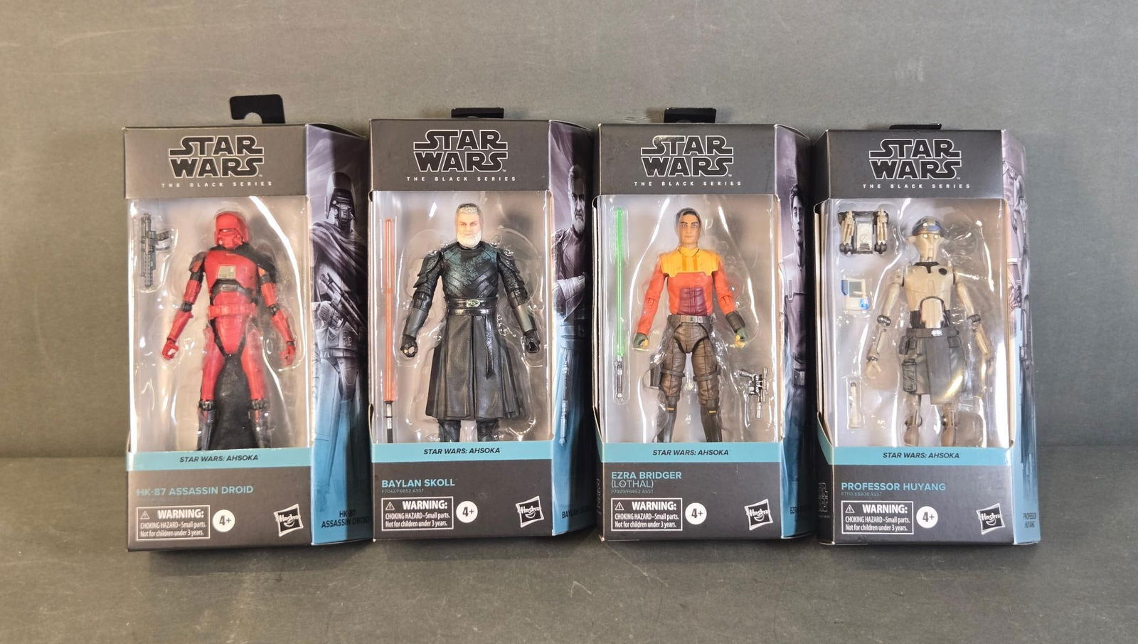 A Group of Four Hasbro Star Wars The Black Series: Ahsoka Action Figures, comprising HK-87 Assassin: A group of four Hasbro 'Star Wars The Black Series' action figures from the 'Star Wars: Ahsoka' collection. The lot includes HK-87 Assassin Droid, Baylan Skoll, Ezra Bridger (Lothalli), and Professor