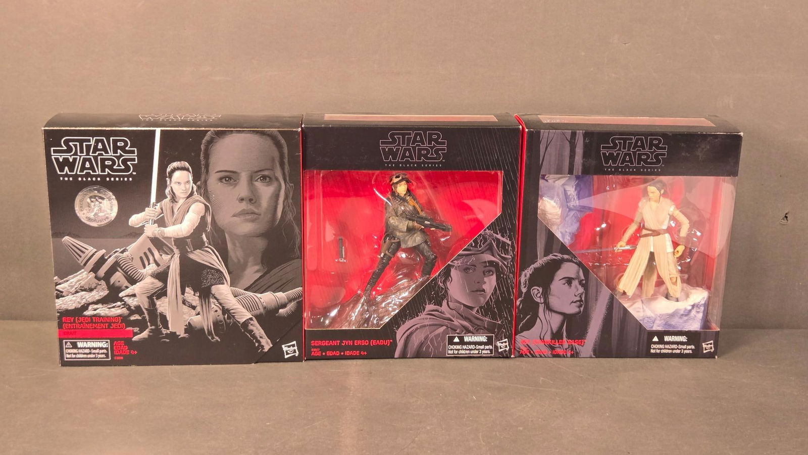 Three Star Wars The Black Series Action Figures: Rey [Jedi Training], Sergeant Jyn Erso (Eadu), and: A group of three Star Wars The Black Series action figures by Hasbro, depicting Rey [Jedi Training], Sergeant Jyn Erso (Eadu), and Rey [Starkiller Base]. Each figure is crafted from plastic and presen