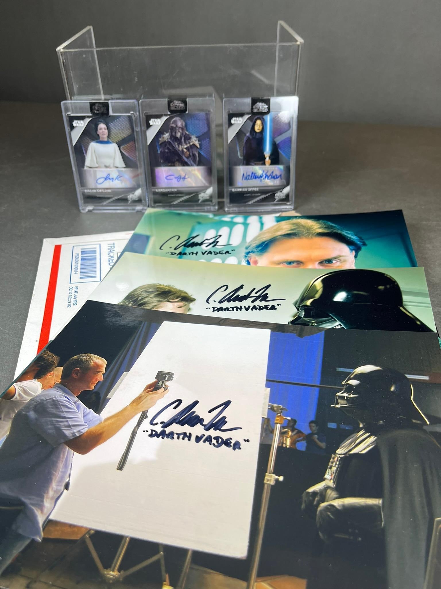 A Collection of Star Wars Collectibles, including Three 2023 Topps Chrome Black Autograph Cards: This lot comprises a diverse collection of Star Wars collectibles. Leading the collection are three 2023 Topps Star Wars Chrome Black autograph cards, each authenticated and signed in blue ink by Simo