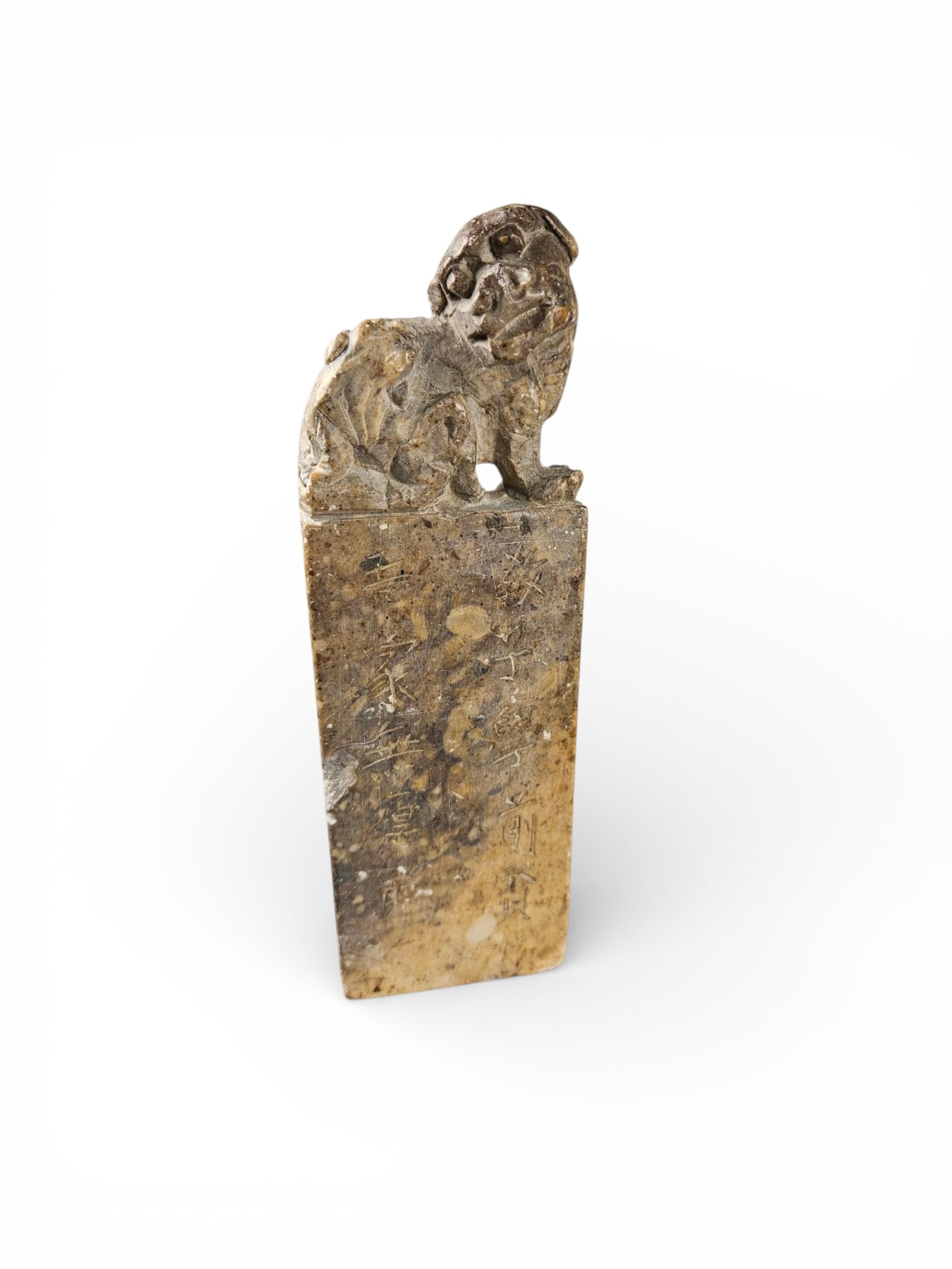 19th/Early 20th Century Chinese Carved Soapstone Foo Dog Seal: A 19th/Early 20th Century Chinese carved soapstone foo dog seal. The piece features a stylized mythical beast finial, commonly referred to as a 'Foo dog', atop a rectangular base. It is crafted from