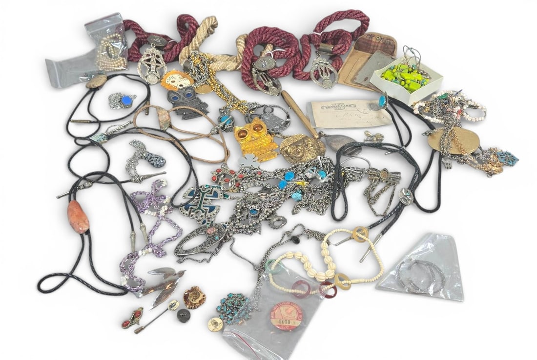 Mixed Lot Costume Jewelry I.O.O.F. Pins Bolo Ties: mixed lot of costume jewelry including silver and gold-tone necklaces, chains, and pendants, featuring I.O.O.F. Symbolic medallions, a large gold owl, turquoise pieces, bolo ties, and various beaded b