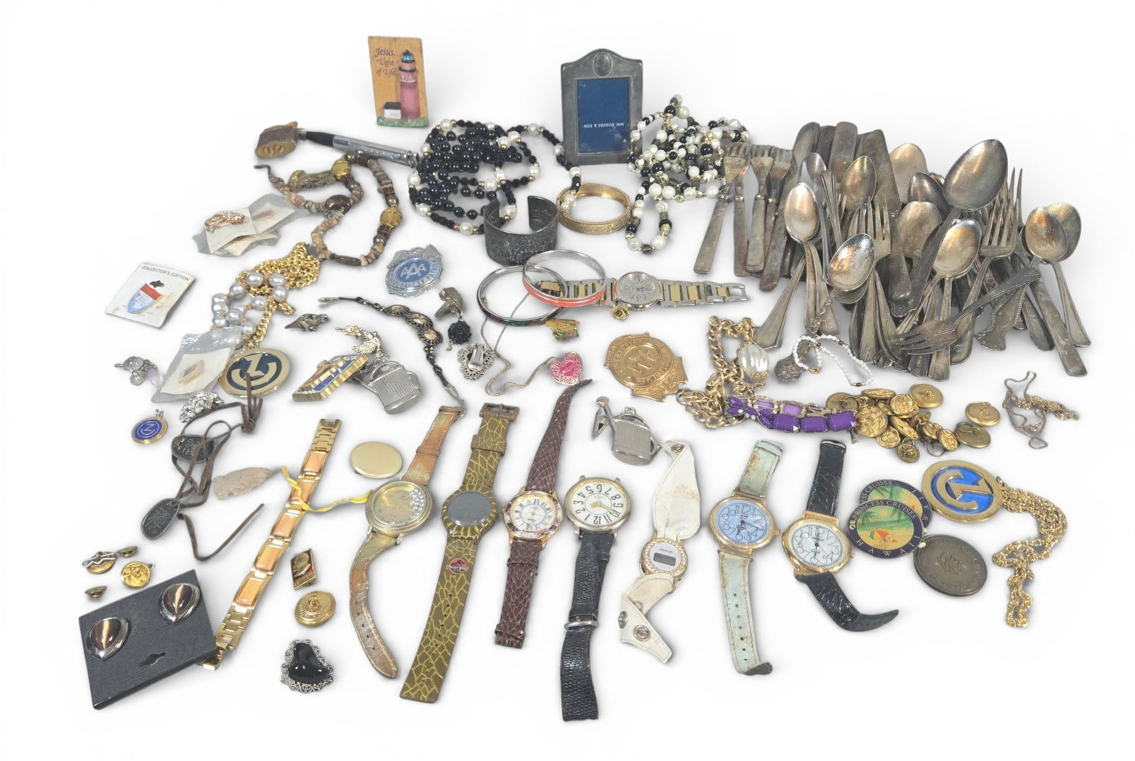 Silverplate Flatware, Costume Jewelry, and Wristwatches: Collection consisting of discrete items or grouped lots of mixed materials, predominantly plated base metals, costume jewelry elements, and timepieces. The most substantial component is a large,