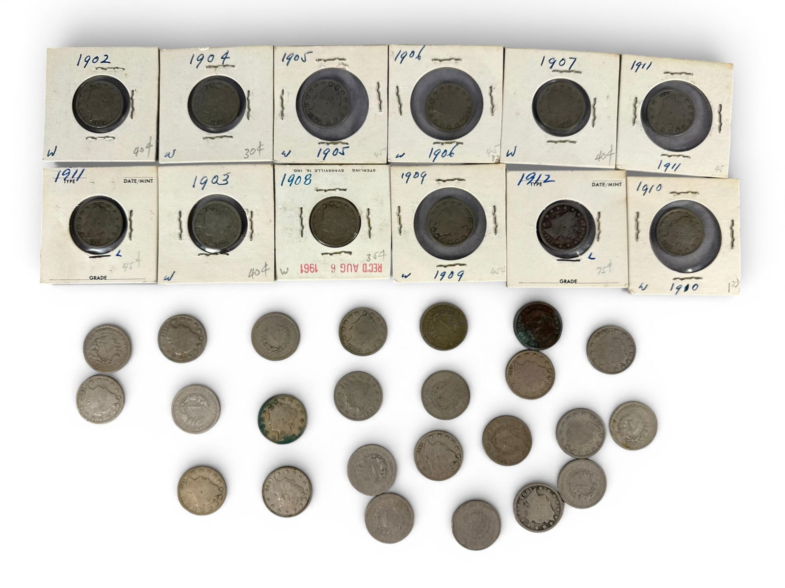 A group of U.S. Liberty Head Nickels V-Nickels: A group of United States Liberty Head Nickels, commonly known as V-Nickels, struck in copper-nickel composition. The lot consists of coins secured in individual cardboard 2x2 flips and loose, scattere