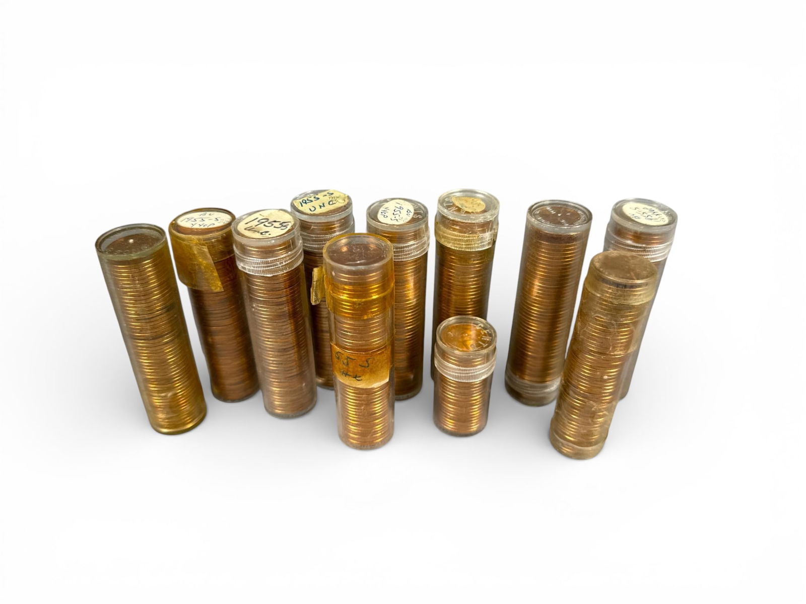 A group of Rolls of U.S. 1955-S Lincoln Wheat Cents, Brilliant Uncirculated and Uncirculated: The lot comprises collection of rolls of U.S. Lincoln Cents, contained within clear plastic cylindrical coin tubes. The coins exhibit a bright, reddish-gold tone, consistent with copper or a high-copp