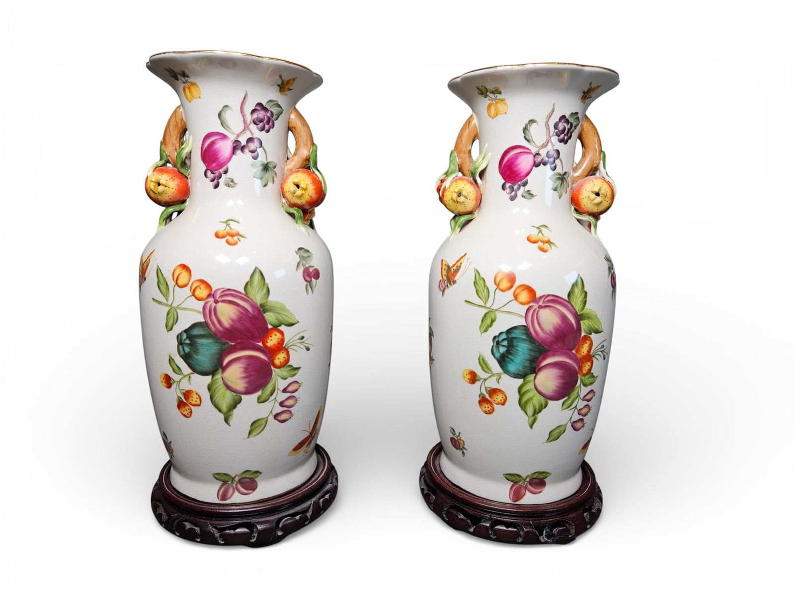 Modern Decorative Ceramic Baluster Vases with Carved Wood Stands: matched modern decorative ceramic baluster vases and their accompanying carved dark wood stands. The vases feature a white crackled (crazed) glaze surface decorated with dense polychrome enamel painti