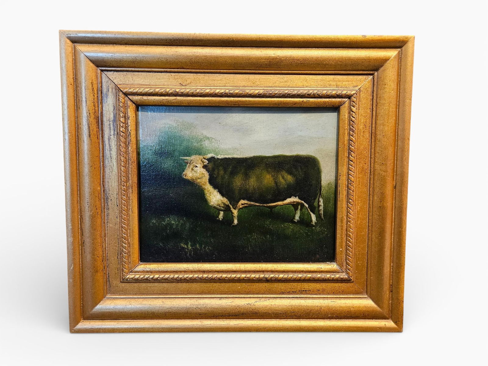 Portrait of a Bull Attributed to Essie Leone Seavey (1872-1932): An oil painting on canvas depicting a profile portrait of a bovine, likely a bull or ox, rendered in a 19th or early 20th-century agricultural or folk style. The animal features a light tan/white head