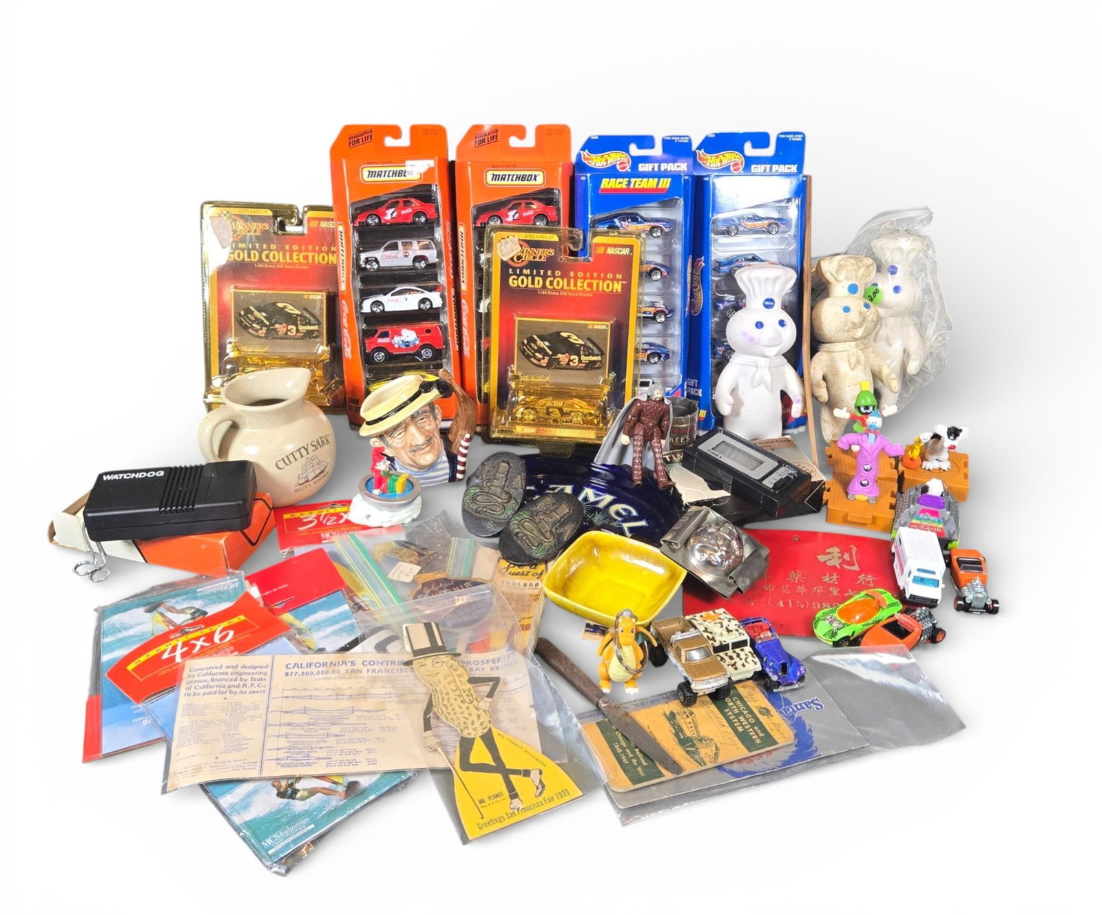A group of Die-Cast Vehicles, Advertising Novelties, and Ephemera: Diverse collection of miscellaneous novelties, promotional items, toys, and ephemera, primarily dating to the mid-to-late 20th century. The collection includes die-cast vehicles, comprising sealed