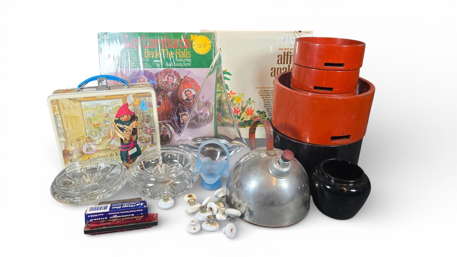 Decorative and Utility Objects Including Murano Glass, Vintage LPs, and Harmonicas: This collection consists of miscellaneous decorative and utility items. Also present is a lithographed metal lunch box marked Crabtree & Evelyn London, decorated with a scene of anthropomorphic