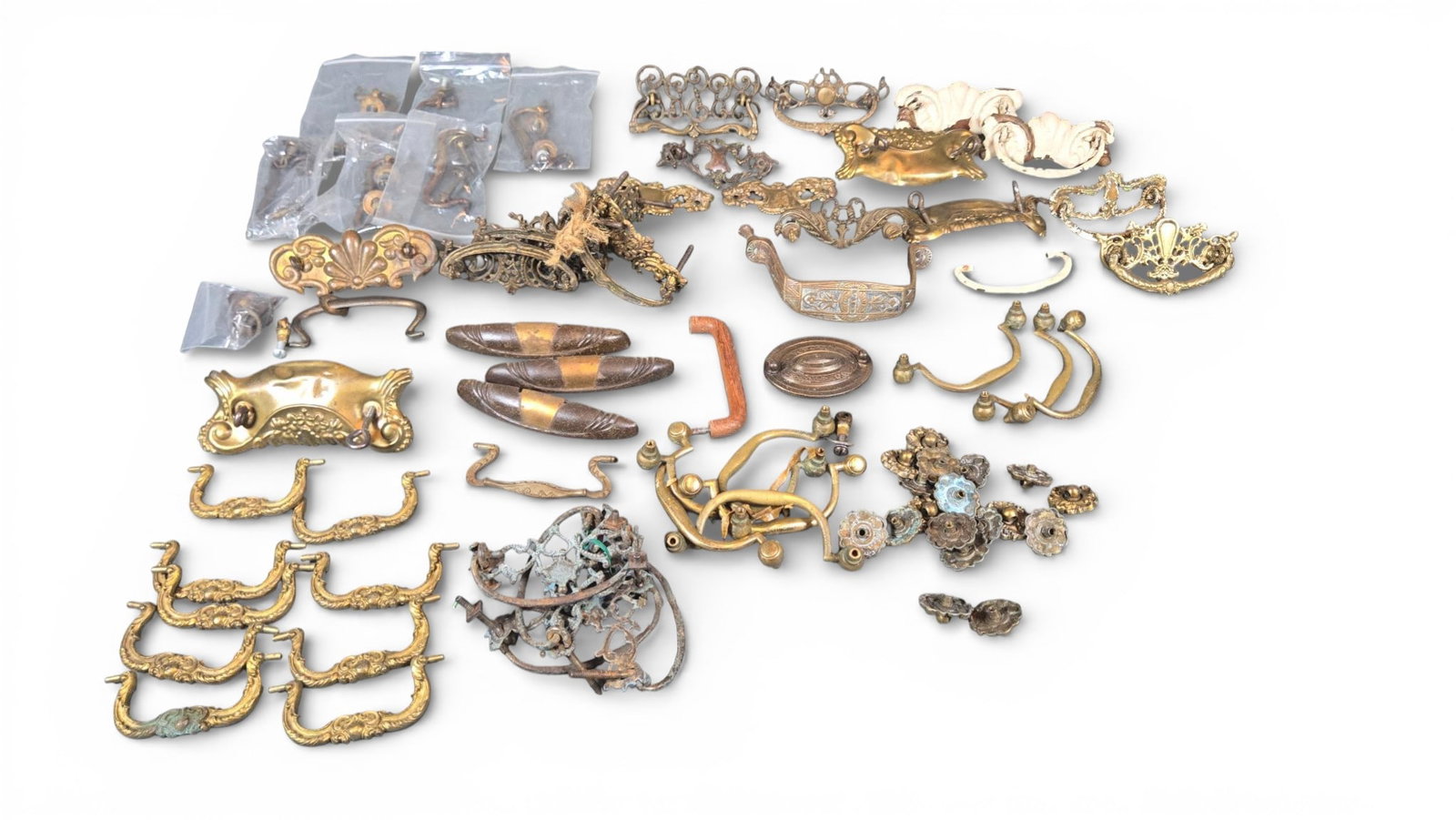Vintage and Antique Furniture Hardware Fittings and Assemblies: Collection of individual items, assemblies, and groups of vintage and antique furniture hardware, primarily consisting of drawer pulls, bail handles, drop handles, escutcheons, and decorative fittings