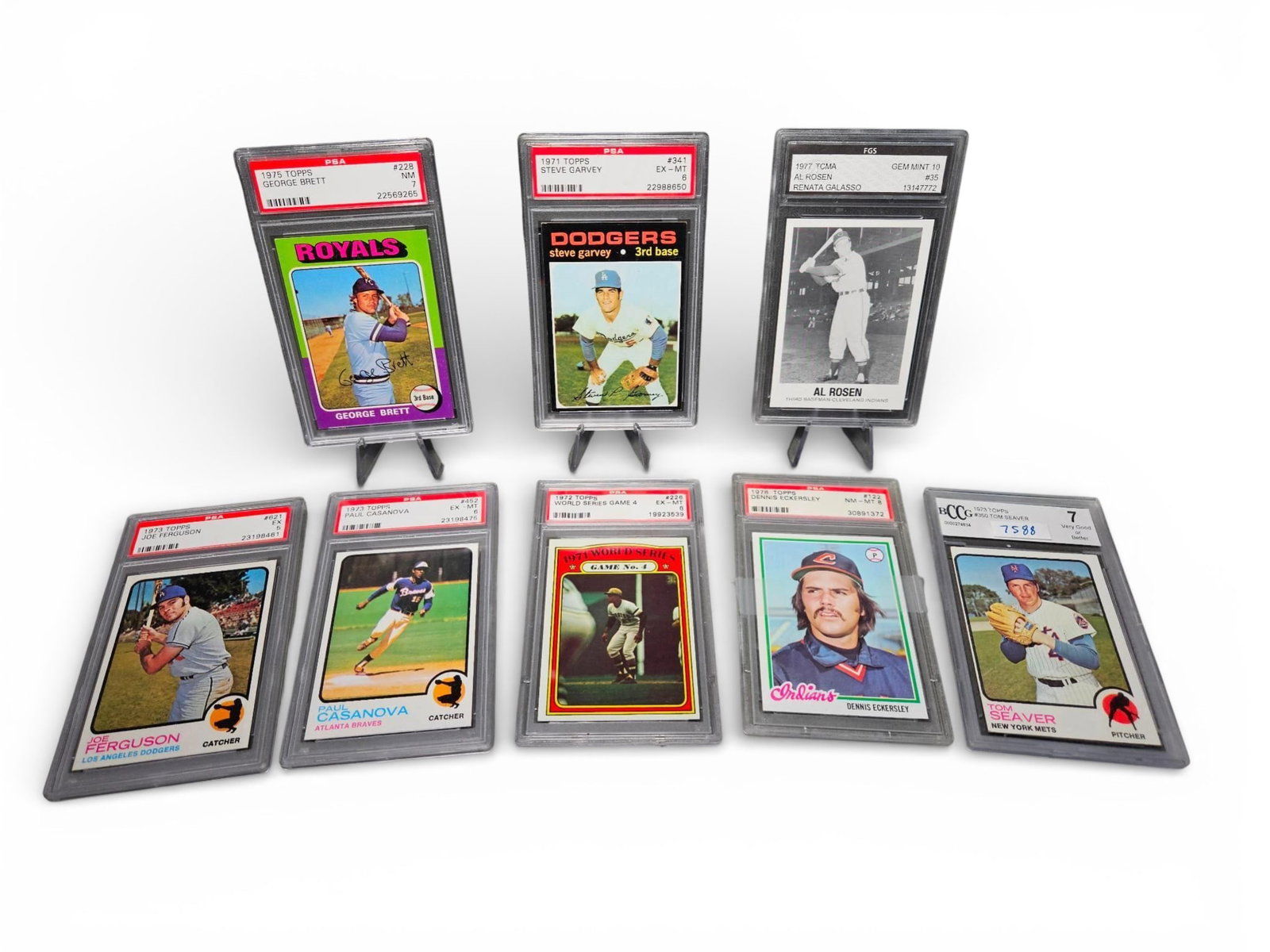 A Collection of Graded Vintage Baseball Cards featuring the 1975 Topps George Brett Rookie Card: A collection of encapsulated vintage baseball trading cards primarily dating from the 1970s (1971–1978). The collection features Hall of Fame and notable players authenticated and graded by third-pa
