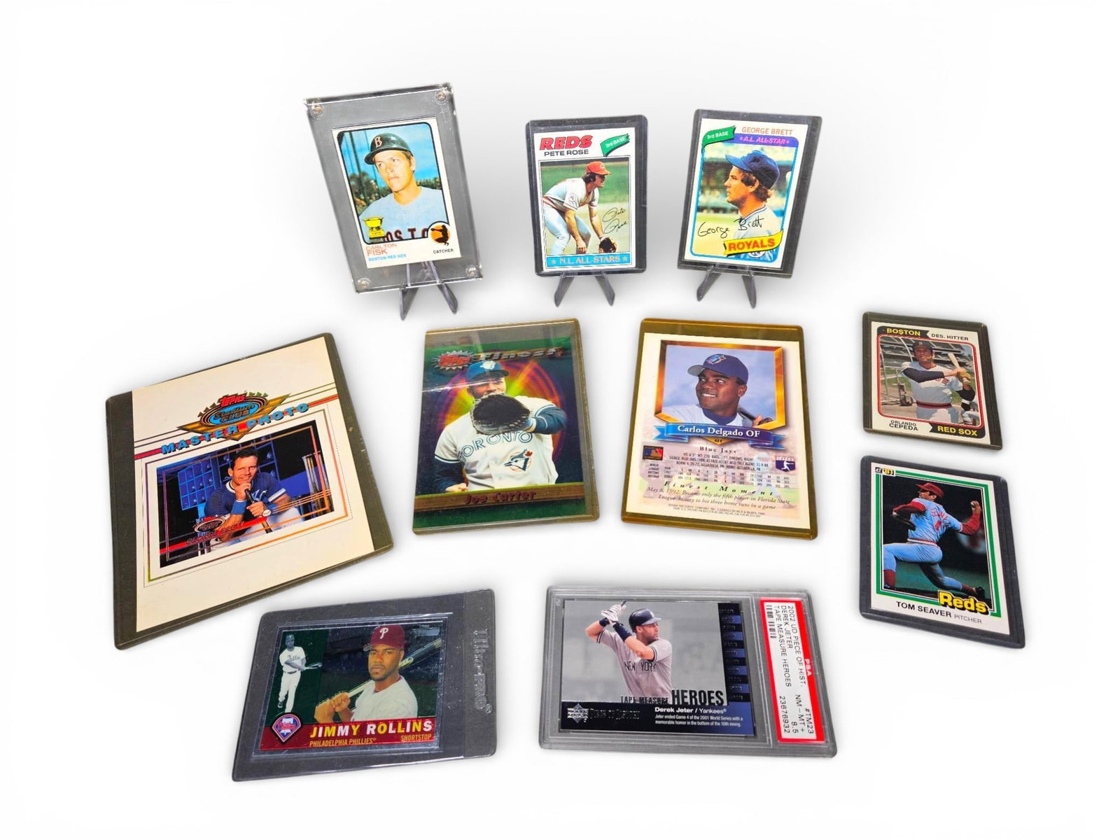 A group of Baseball Cards and Photo Product including Graded 2002 Upper Deck Derek Jeter PSA 8.5 (1 of 11)
