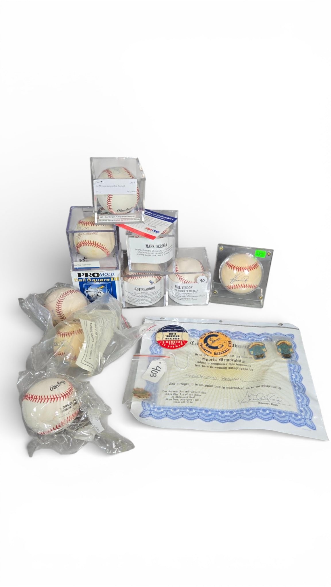 A group of Items of Autographed Baseball Memorabilia and Pins: A group of items of baseball memorabilia, comprising autographed baseballs, assorted pins and buttons, and associated Certificates of Authenticity (COA) documents or cards. The baseballs are standard