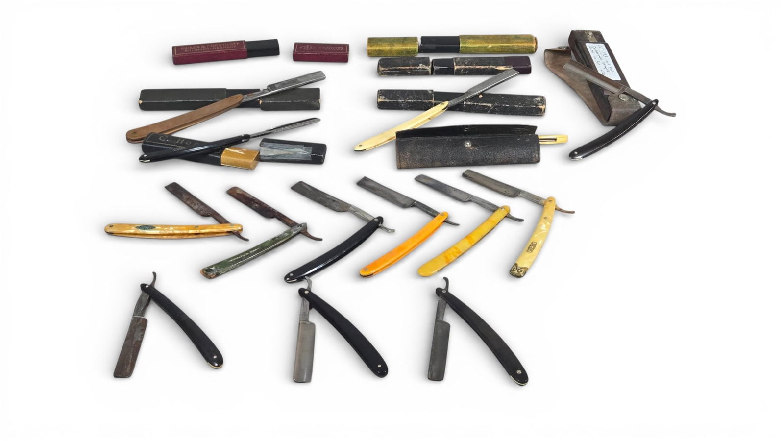 Vintage Straight Razors and Associated Storage Cases: Collection comprising items, consisting primarily of vintage straight razors and accompanying storage boxes and cases. The razors feature polished steel or carbon steel blades of styles, paired with