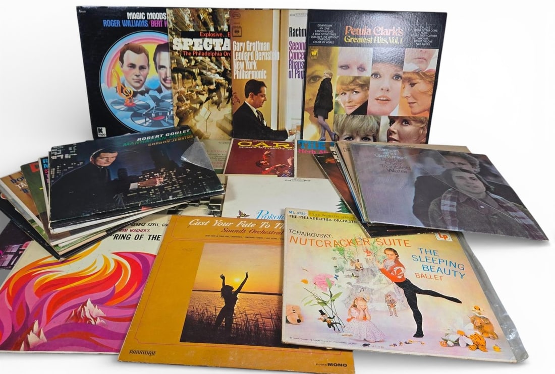A group of Vintage Inch LP Vinyl Records, Mixed Genres: This lot comprises collection of vintage inch long-playing (LP) vinyl records, housed in their original cardboard jackets. The collection spans musical genres from the mid-to-late 20th century,