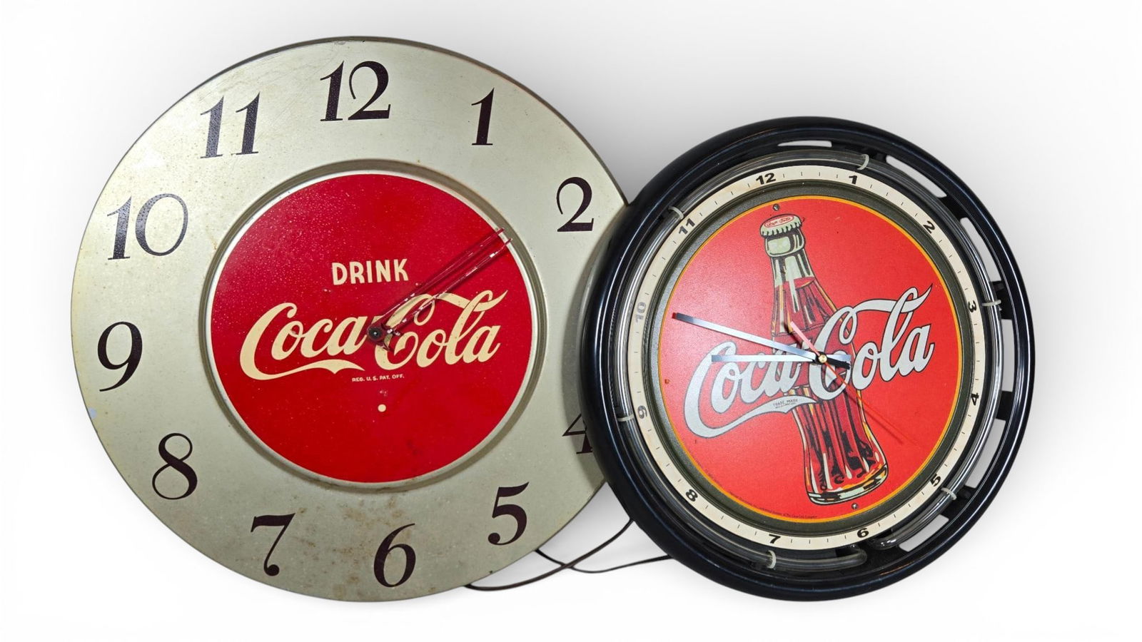 Coca-Cola Advertising Wall Clocks Including Vintage 1950s General Electric: Coca-Cola advertising wall clocks spanning mid-century vintage and modern reproduction styles. The first clock is a large, vintage electric wall clock dating to the 1950s. It features an aluminum or m