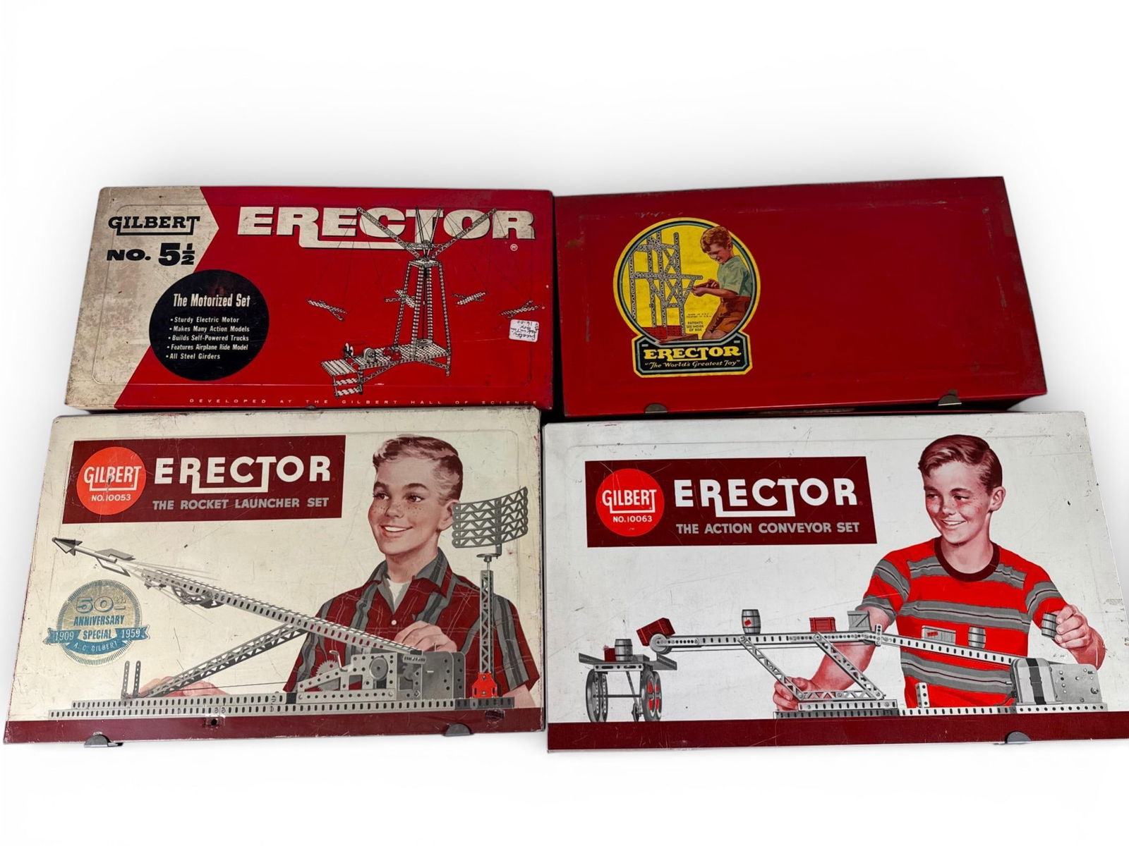 A Collection of Vintage Gilbert Erector Construction Sets: A collection of vintage Gilbert Erector construction sets including No. /, No. 10053 Rocket Launcher, No. 10063 Action Conveyor, and No. /, featuring metal storage cases with various components and mo