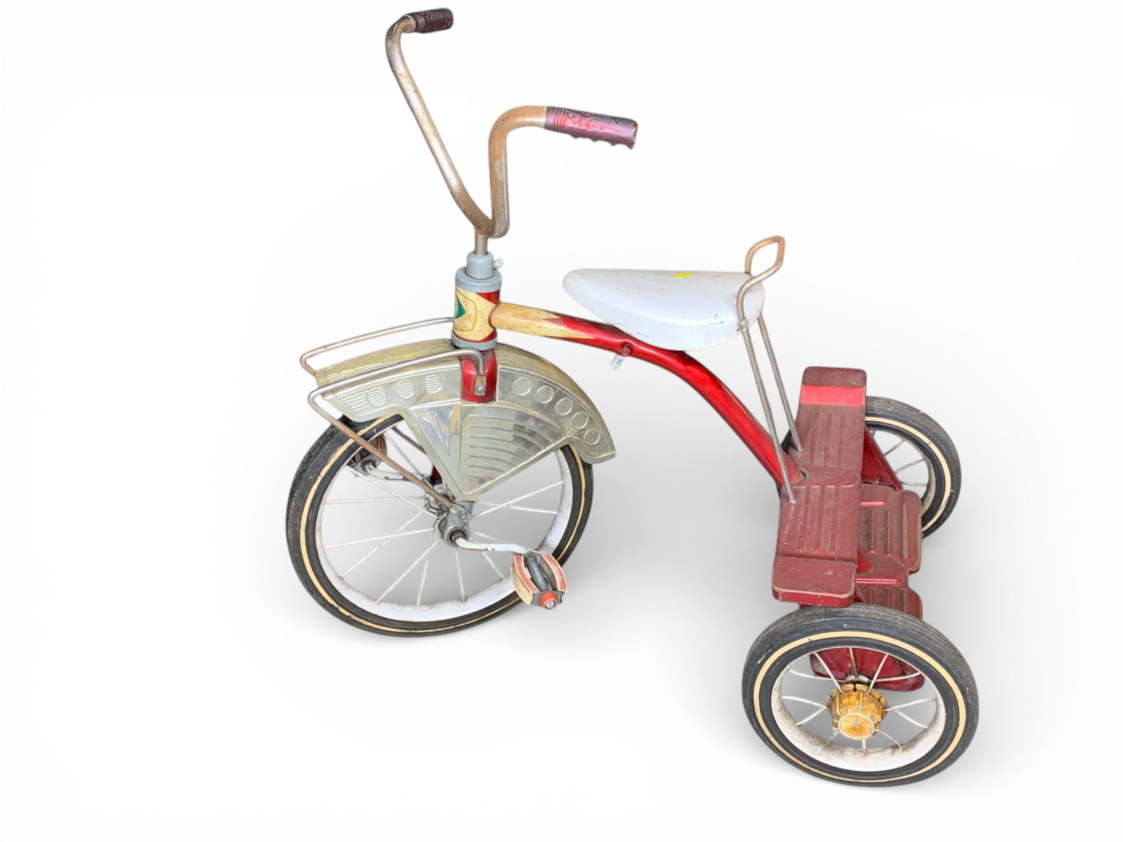 Vintage Western Flyer Streamlined Children's Tricycle: A vintage children's tricycle manufactured by Western Auto Stores under the "Western Flyer" brand, characterized by its mid-20th-century streamlined aesthetic often associated with Murray trikes of th