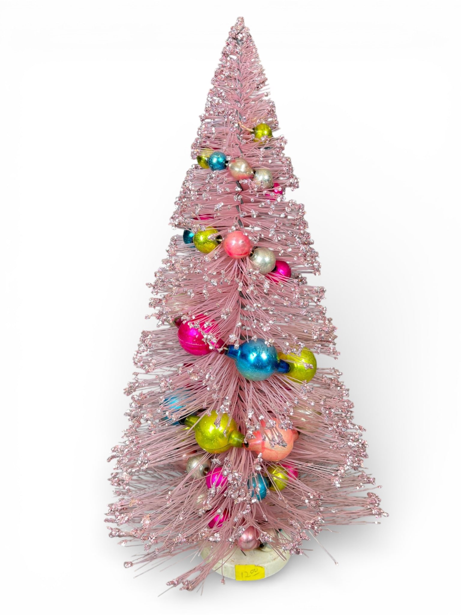 Vintage Mid-Century Pink Bottle Brush Christmas Tree with Glass Ornaments: A vintage Mid-Century Modern table-top Christmas tree constructed of pink plastic or nylon bristles, commonly referred to as a bottle brush tree. The conical form is heavily flocked with fine silver