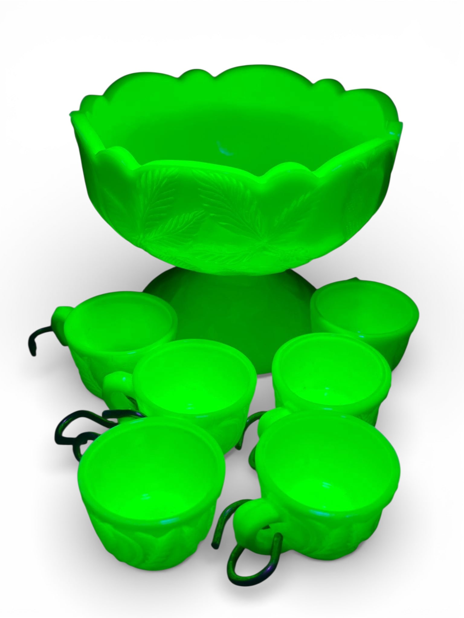 Mosser Glass Miniature Custard Uranium Punch Bowl Set, Collection of Items: A complete miniature punch bowl set attributed to Mosser Glass, consisting of a footed punch bowl and matching miniature cups. The set is crafted from pressed opalescent Custard glass, presenting a