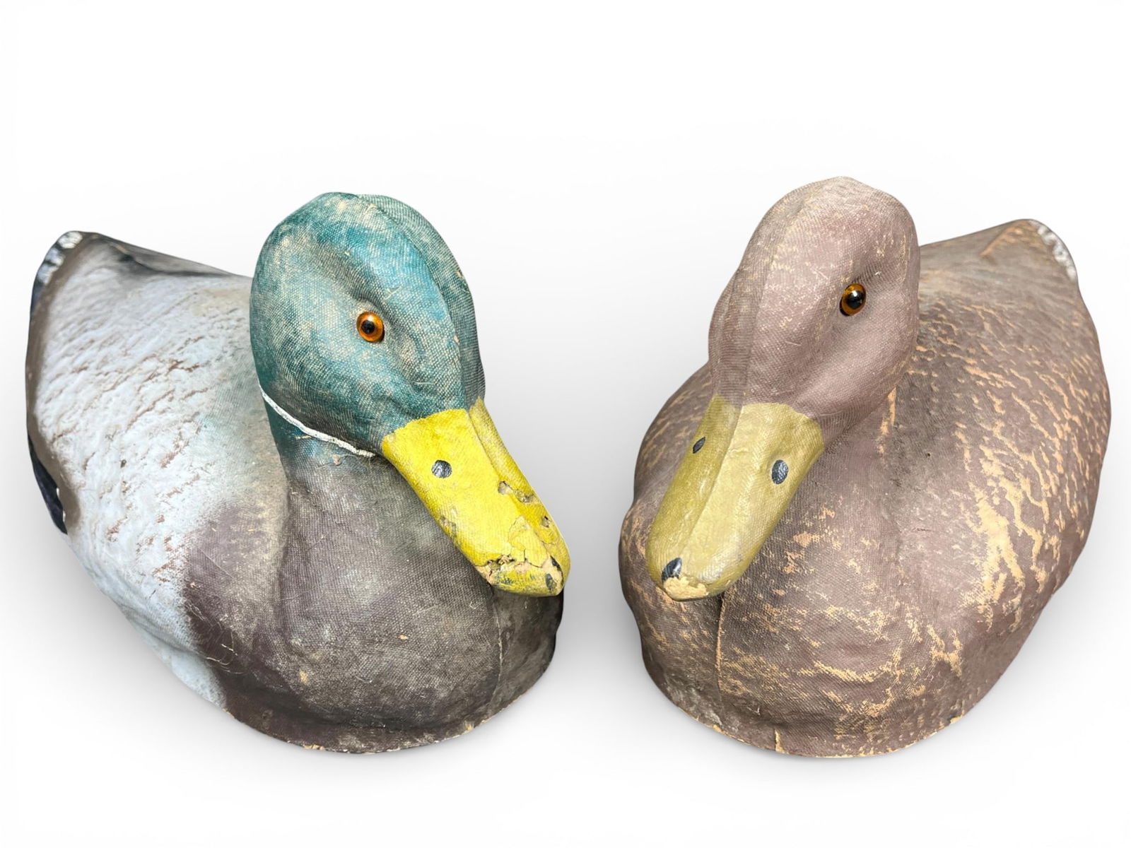 A group of J.C. Higgins Life-Like Mallard Duck Decoys: A group of vintage duck hunting decoys attributed to the J.C. Higgins 'Life-Like Decoy' line, originally sold by Sears Roebuck and Co. The decoys are constructed of molded composite material or heavy