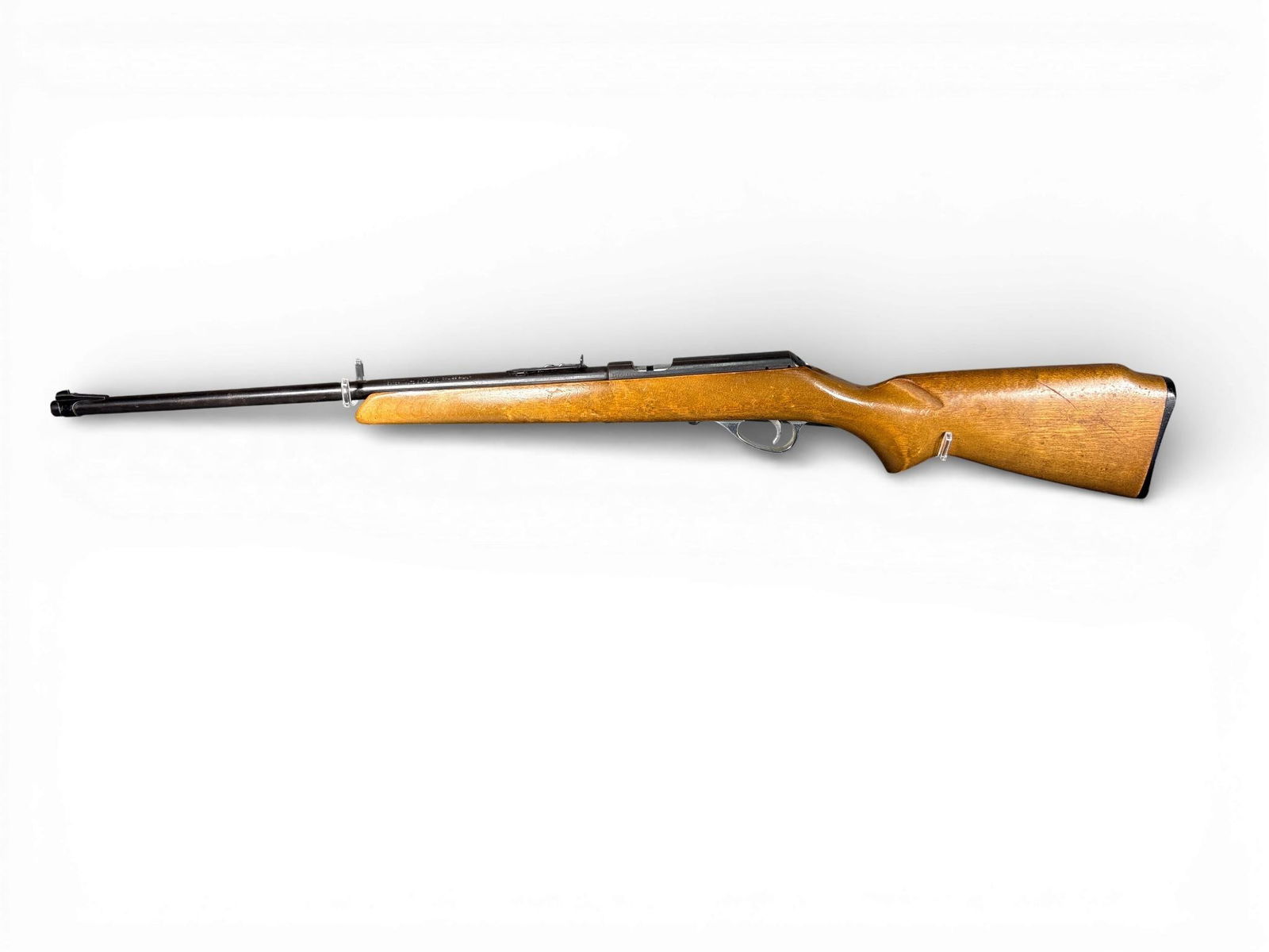* Revelation Model 105M Bolt Action Rifle: This Revelation Model 105M is a bolt action rifle manufactured by The Marlin Firearms Co. for Western Auto Supply Co. The firearm is chambered for .22 S-L-LR and features a 22 inch blued steel