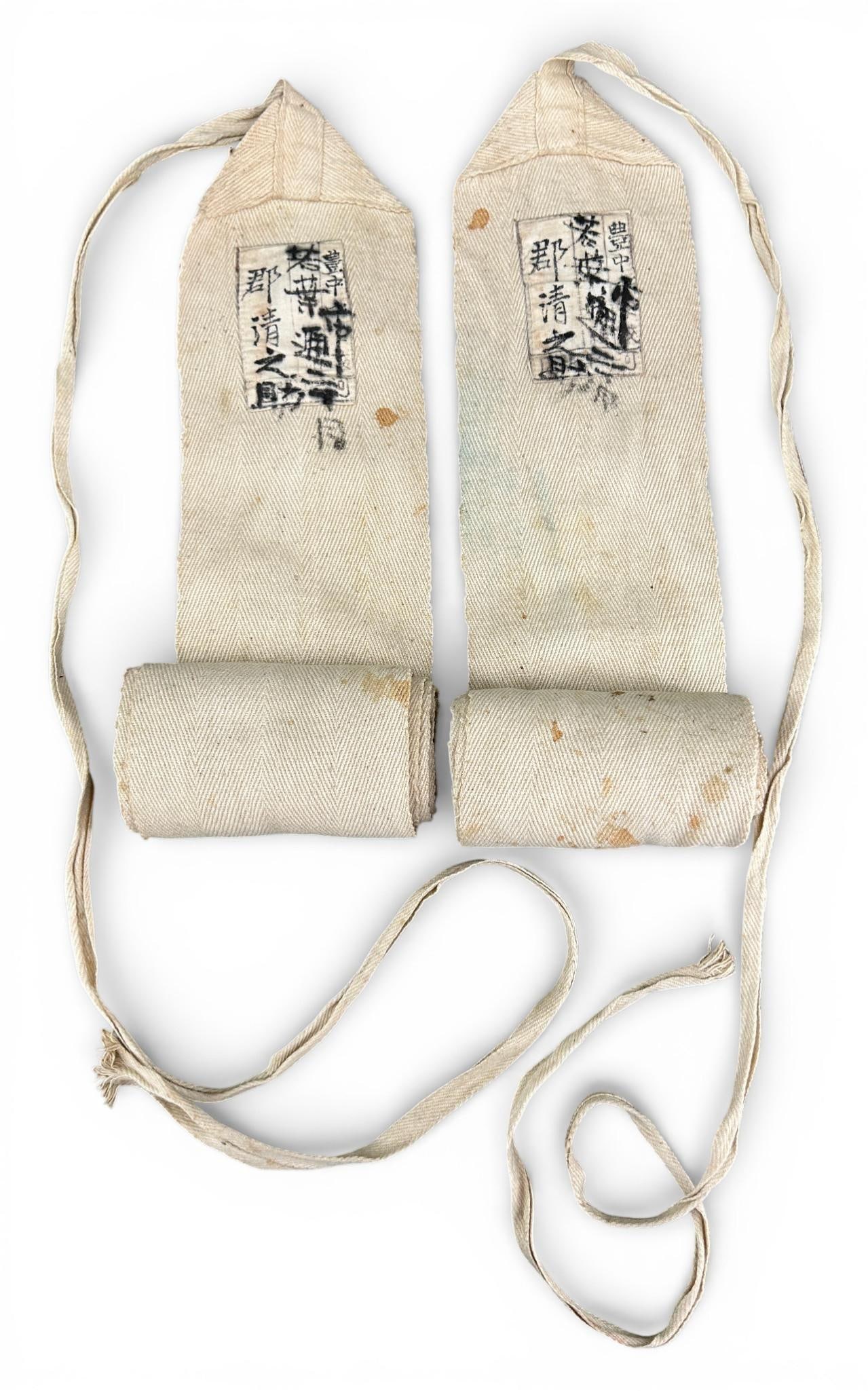 WWII Imperial Japanese Army IJA Leg Wraps - Puttees: Pair of World War Two Imperial Japanese Army ribbed cotton leggings – puttees. Each legging measures 69" x 3.625" with a 34" attached strap. These leggings show minimal wear having a few stains and