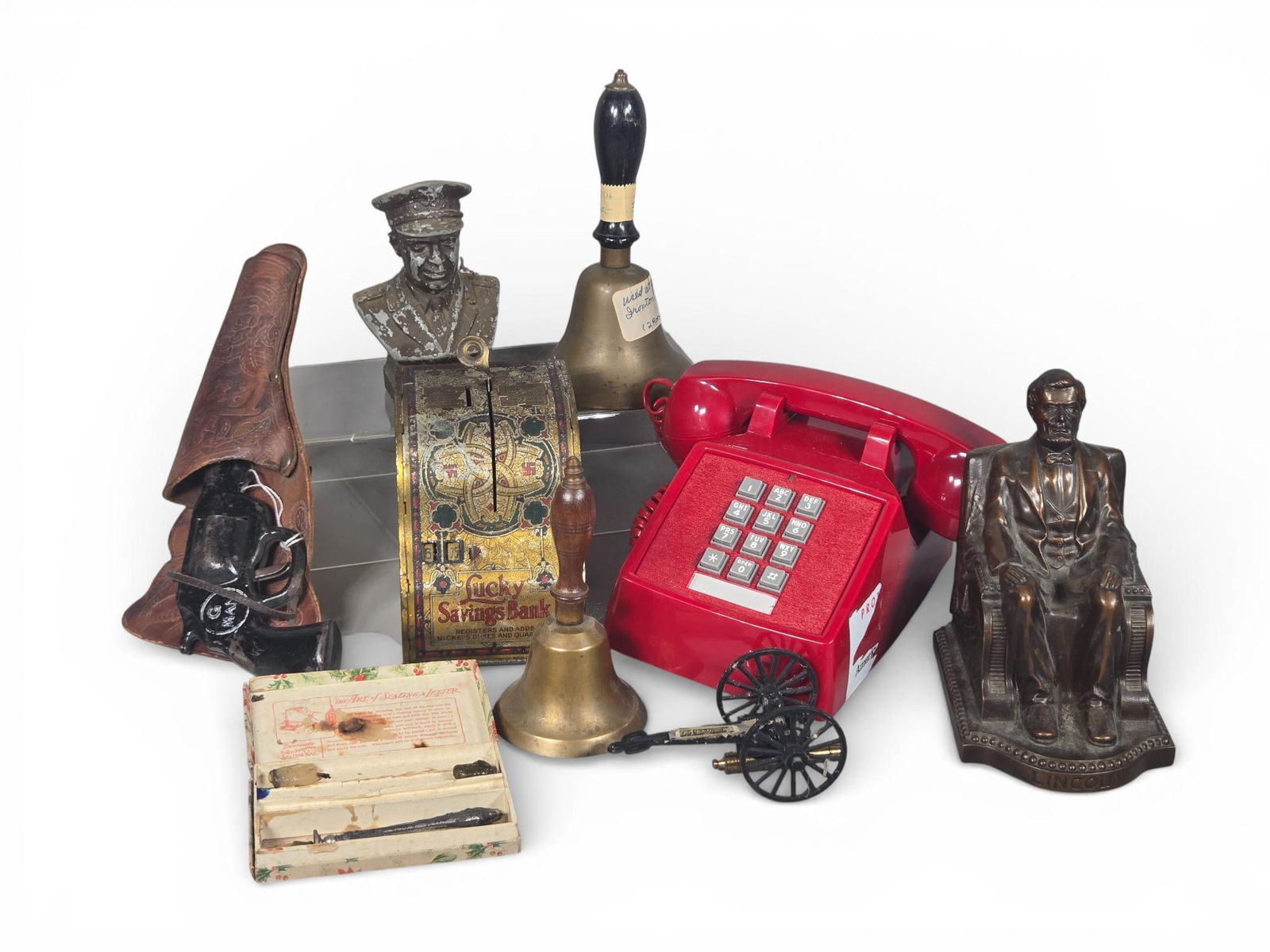 An Assortment of Vintage and Antique Collectibles and Novelty Items: A collection of various vintage and antique collectibles and novelty items. The group features a lithographed tin Lucky Savings Bank manufactured by Shonk Works - American Can Co. of Maywood, Illinois