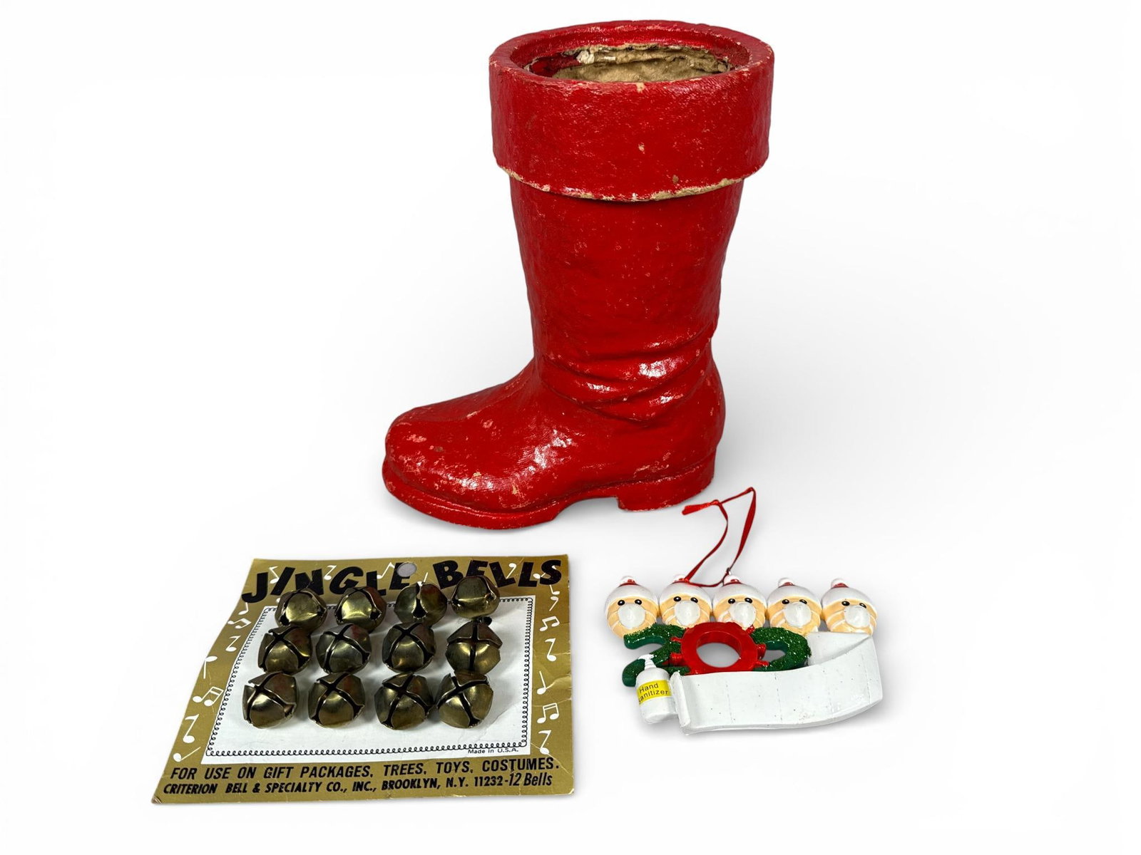 Criterion Bell and Vintage Papier-Mche Holiday Decor Collection, Mid-Century and Contemporary: This curated three-piece holiday collection features a variety of seasonal items spanning the mid-century to the modern era. The primary piece is a vintage red papier-mche Santa Claus boot, designed a