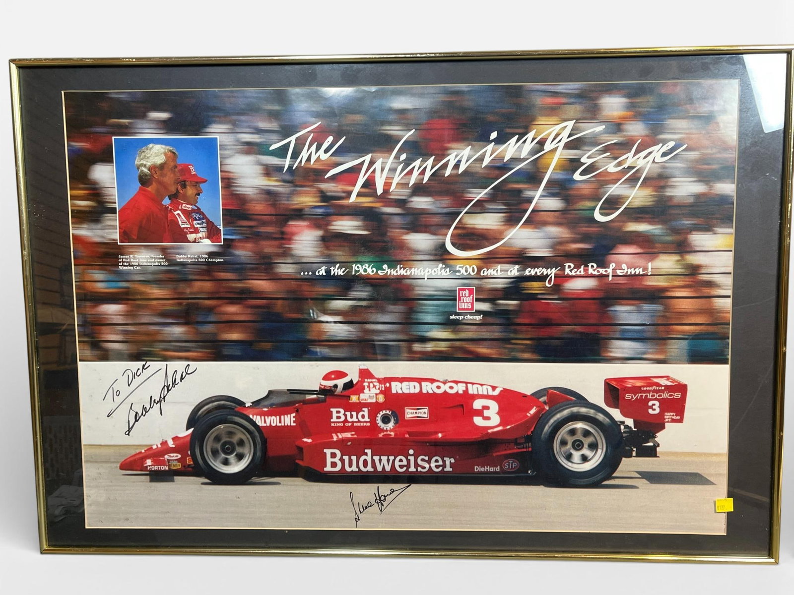 Bobby Rahal and Jim Trueman Signed 1986 Indianapolis 500 Commemorative Poster: This commemorative poster, titled The Winning Edge, celebrates Bobby Rahal's historic victory at the 1986 Indianapolis 500. The display features the number 3 Budweiser and Red Roof Inn March 86C race