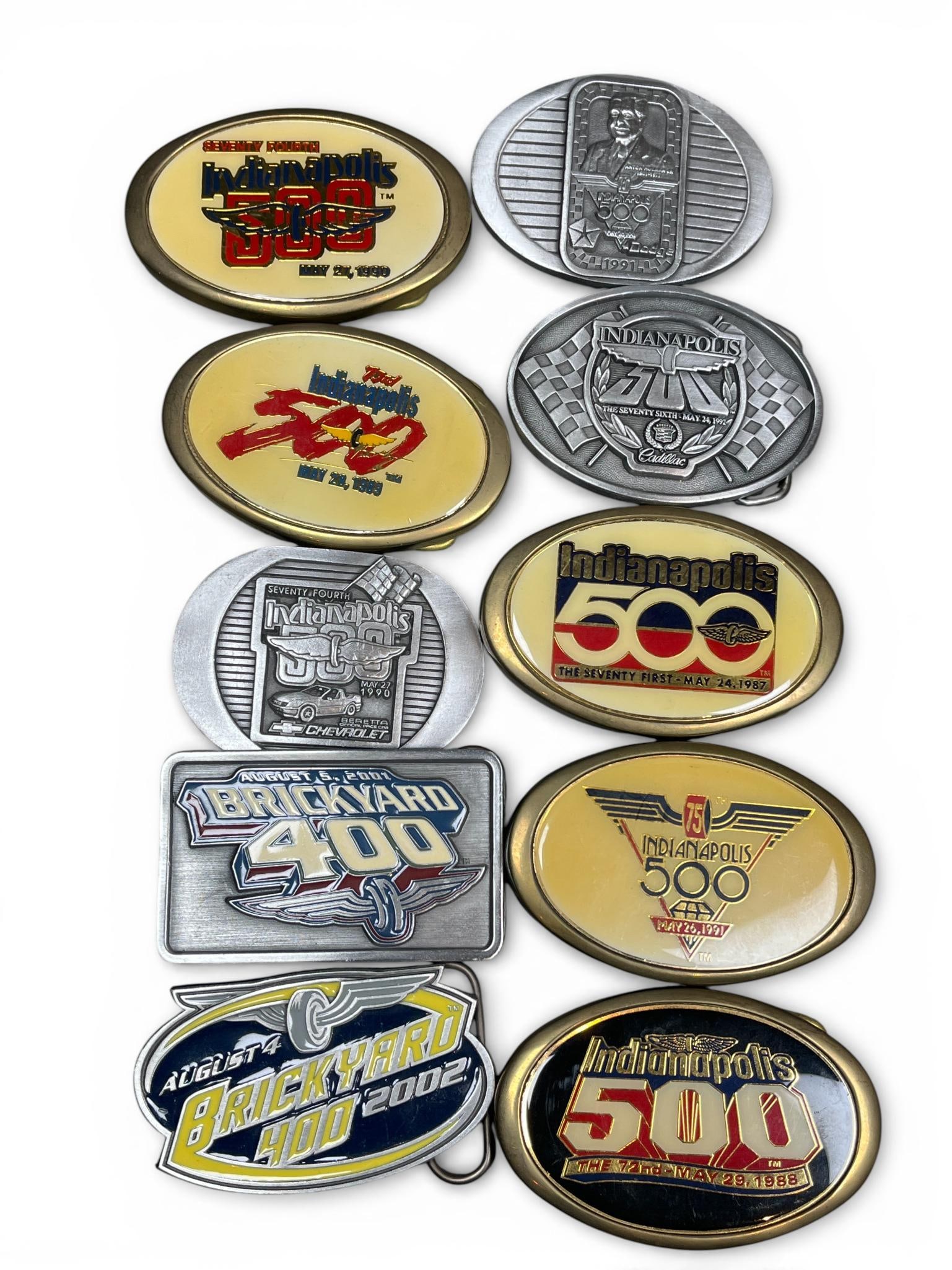 Siskiyou and S.R.E. Indianapolis 500 and Brickyard 400 Commemorative Belt Buckle Collection, 10: This curated collection features ten commemorative belt buckles celebrating the legacy of the Indianapolis 500 and the Brickyard 400 motor racing events. The assembly includes five oval-shaped solid b