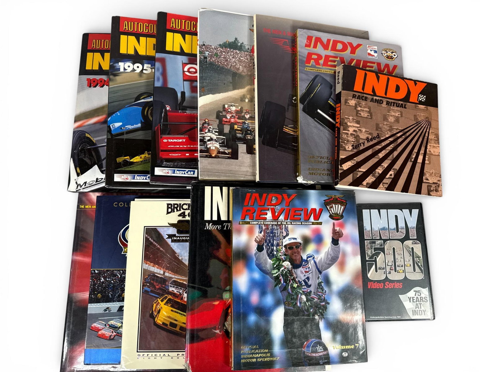 Various Authors, Collection of Twelve (12) IndyCar, Indianapolis 500, and NASCAR Yearbooks and: This comprehensive collection contains twelve items focused on the history and statistics of IndyCar, the Indianapolis 500, and NASCAR racing. The lot includes three volumes of the Autocourse Official