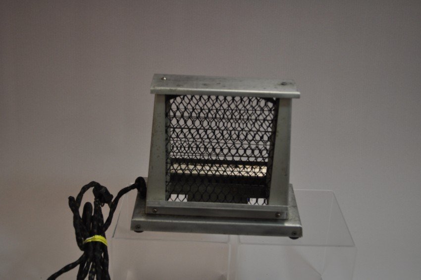 Antique toaster.: No name on it. Side fed. Height: 6.25” Note: If you are interested in seeing a short video of these toasters from multiple perspectives, please go to YouTube and search: "adrian burns" + "toasters"
