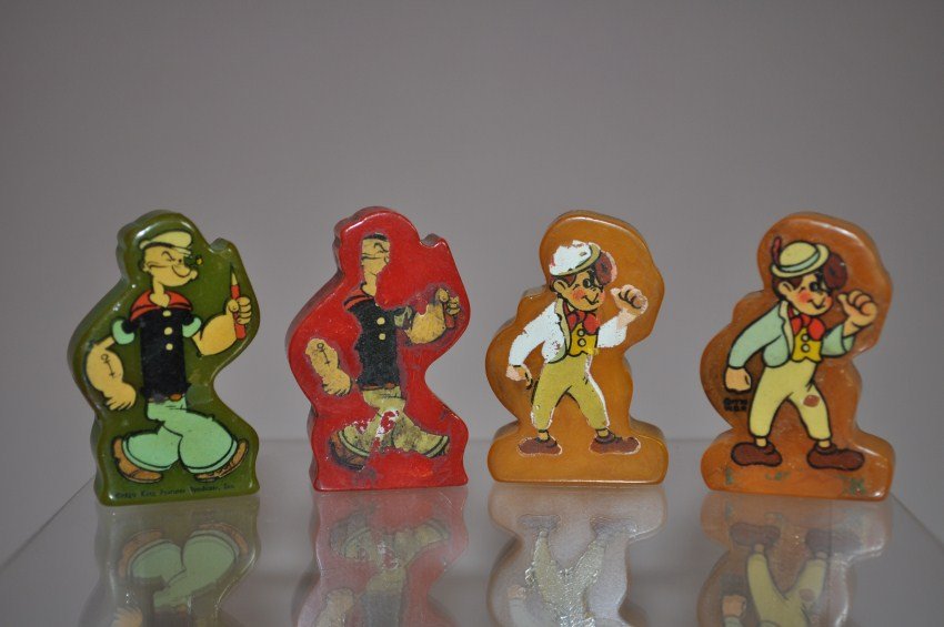 Four Bakelite 1920s Popeye Etc. Toy Pencil Sharpeners: Two popeye, two others are boys from a cartoon. Fantastic pieces. Shipping 8.