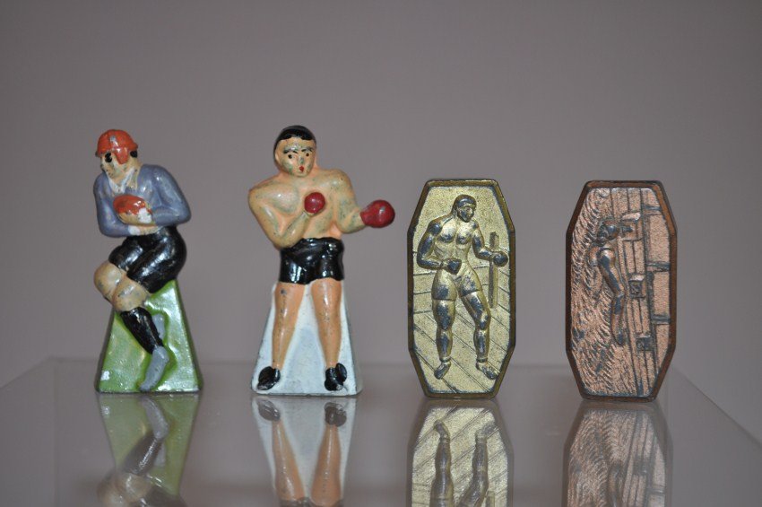 4 Rare Metal Pencil Sharpeners – Boxing, Football, etc: Rare lot. Largest is 1.75” high (football player). Coffin-shaped are marked Germany and the other two are Made in Japan. Shipping 8.