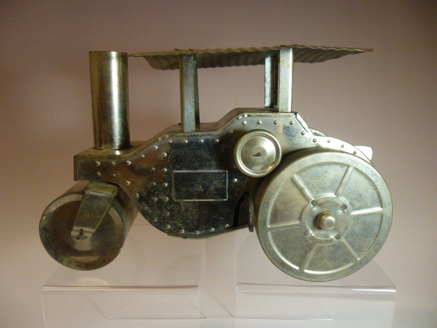 Tin Clockwork Key-wind Stream Roller Toy.: Winds up and runs. 11.5” long. Shipping: 20.