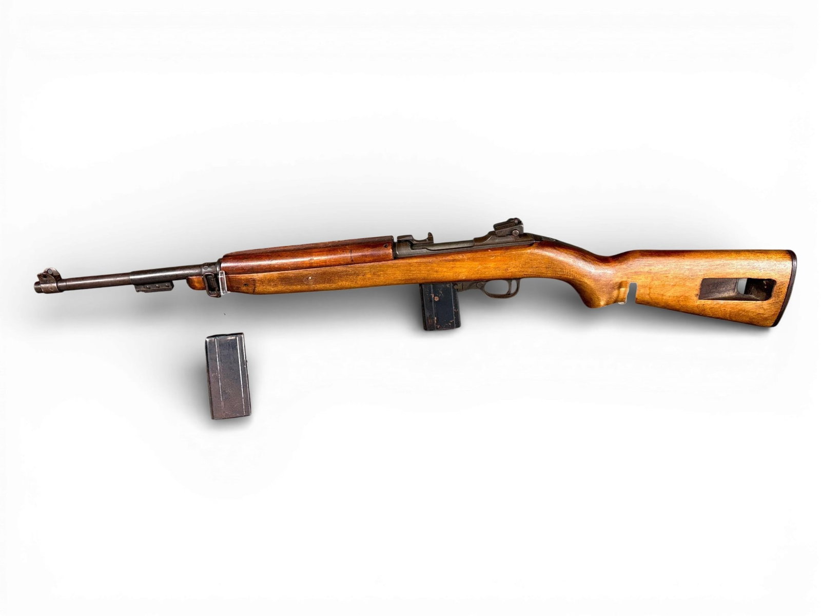 ** Underwood M1 Carbine .30 Caliber Semi-Automatic Rifle: An Underwood-manufactured M1 Carbine chambered in .30 M1 featuring an 18-inch barrel and a wooden stock. The receiver is marked U.S. CARBINE CAL .30 M1 and UNDERWOOD above serial number 2774107. The