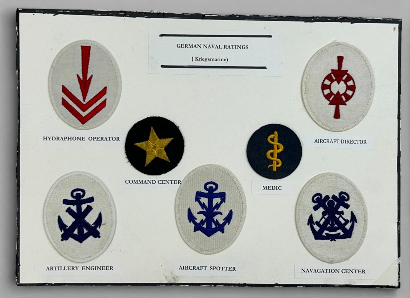 WWII Nazi German Navy Kriegsmarine Military Patch Sleeve Ratings lot: World War Two lot consisting of seven Naval Kriegsmarine Military Patch Sleeve Ratings Display. The patches include: Hydraphone Operator; Artillery Engineer; Command Center; Aircraft Spotter; Medic; A