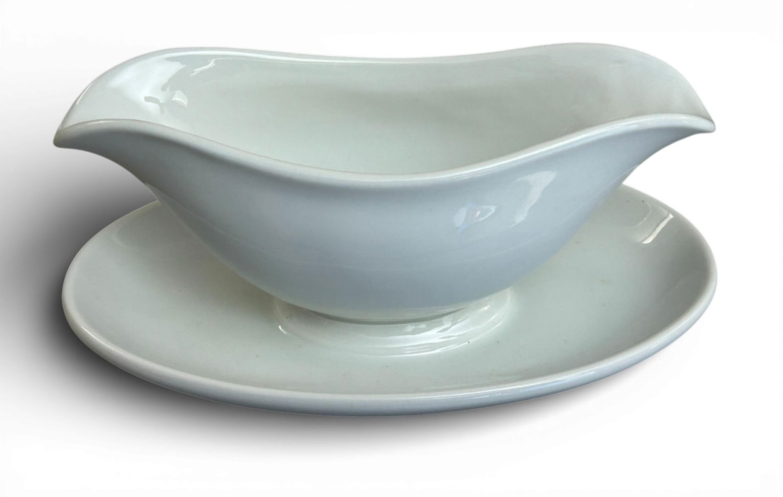 WWII German Wehrmacht - Heer 1939 Porcelain Gravy - Sauce Boat by Johann Haviland Bavaria: World War II Nazi German Wehrmacht - Heer porcelain sauce - gravy boat. The obverse is plain and the reverse is stamped with an eagle clutching a wreathed swastika, a manufacture date of 1939 and make